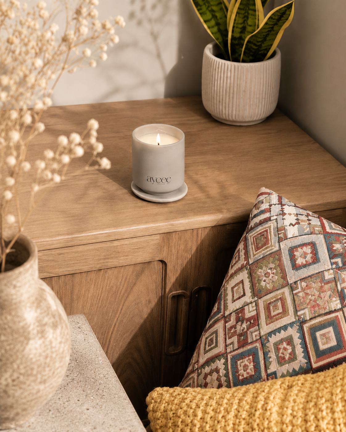 Candle on a wooden surface with decorative elements