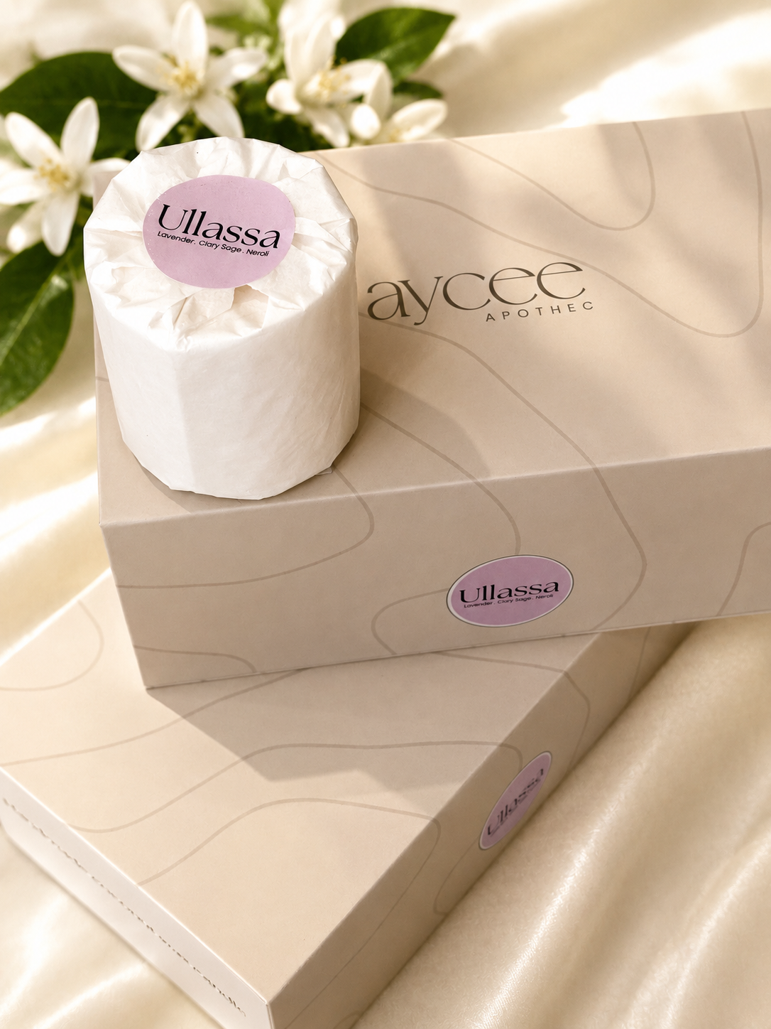 Ullassa candle wrapped in paper with packaging on a light surface with flowers in the background
