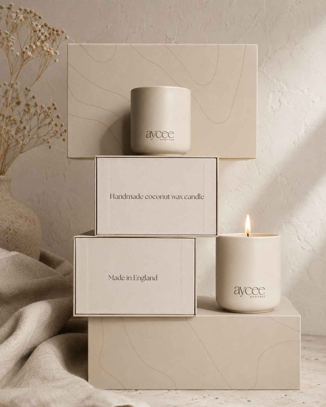 Aycee Apothec white ceramic candle jars with packaging on a wooden 